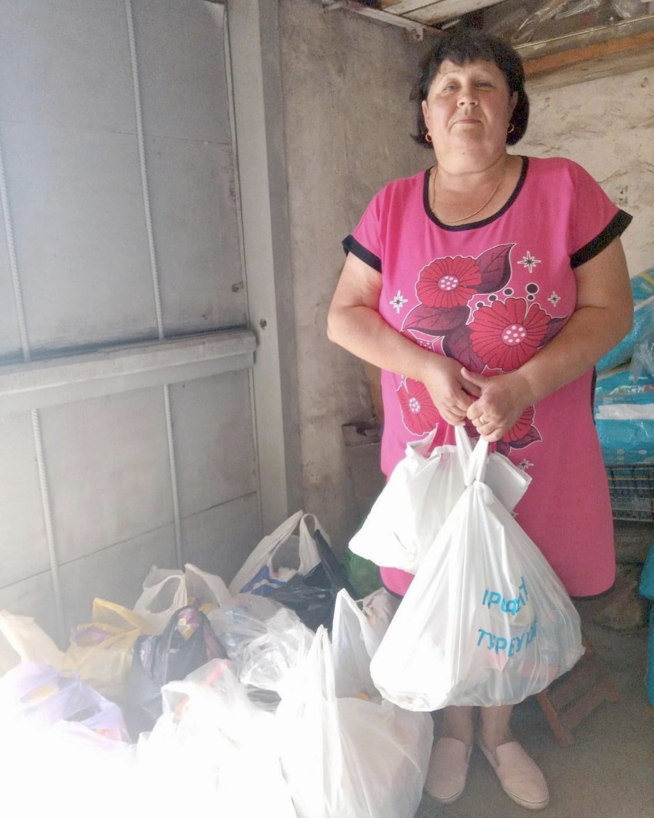 woman receiving food supplies